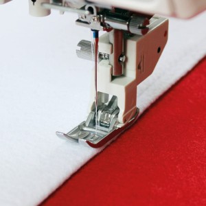 Wąska stopka AcuFeed Flex z górnym transportem Janome (rotacyjny 9 mm)