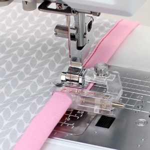 Stopka do wszywania zaprasowanej lamówki Janome (rotacyjny, 9 mm)