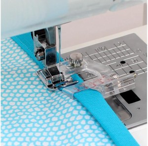 Stopka do wszywania zaprasowanej lamówki Janome (rotacyjny)